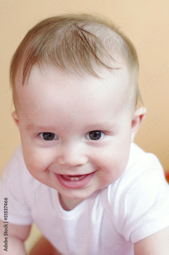 portrait of the laughing baby age of 7 months