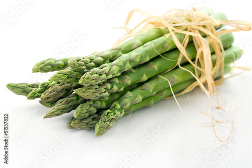 Green asparagus on white background