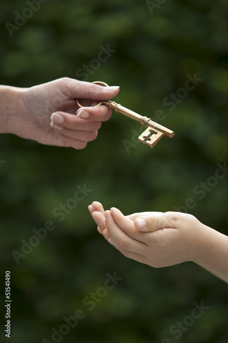 adult hands key to child