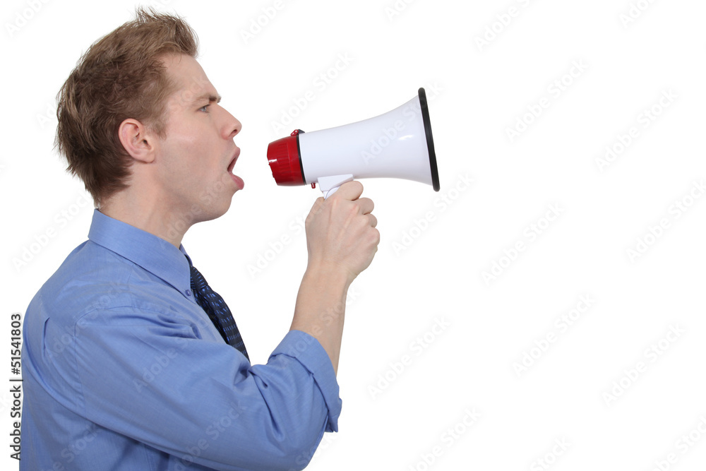 young businessman shouting in loudspeaker young businessman shouting in loudspeaker