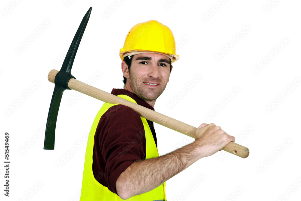 Laborer with pickaxe on his shoulder Laborer with pickaxe on his shoulder