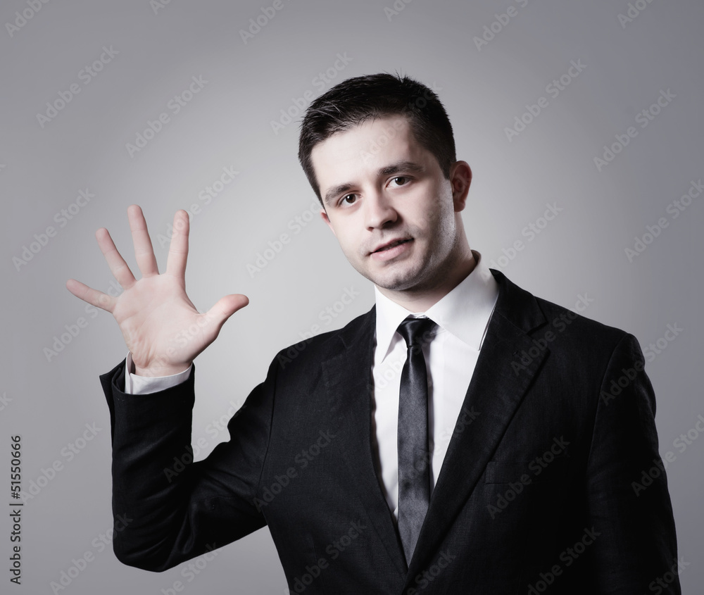 Happy businessman showing five fingers Happy businessman showing five fingers