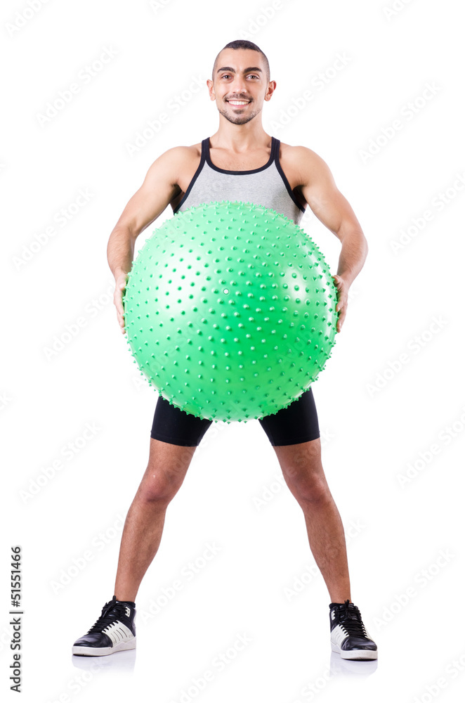 Man with swiss ball doing exercises on white Man with swiss ball doing exercises on white