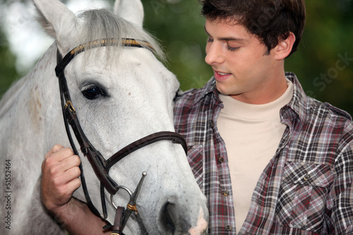 Young man with a horse photo