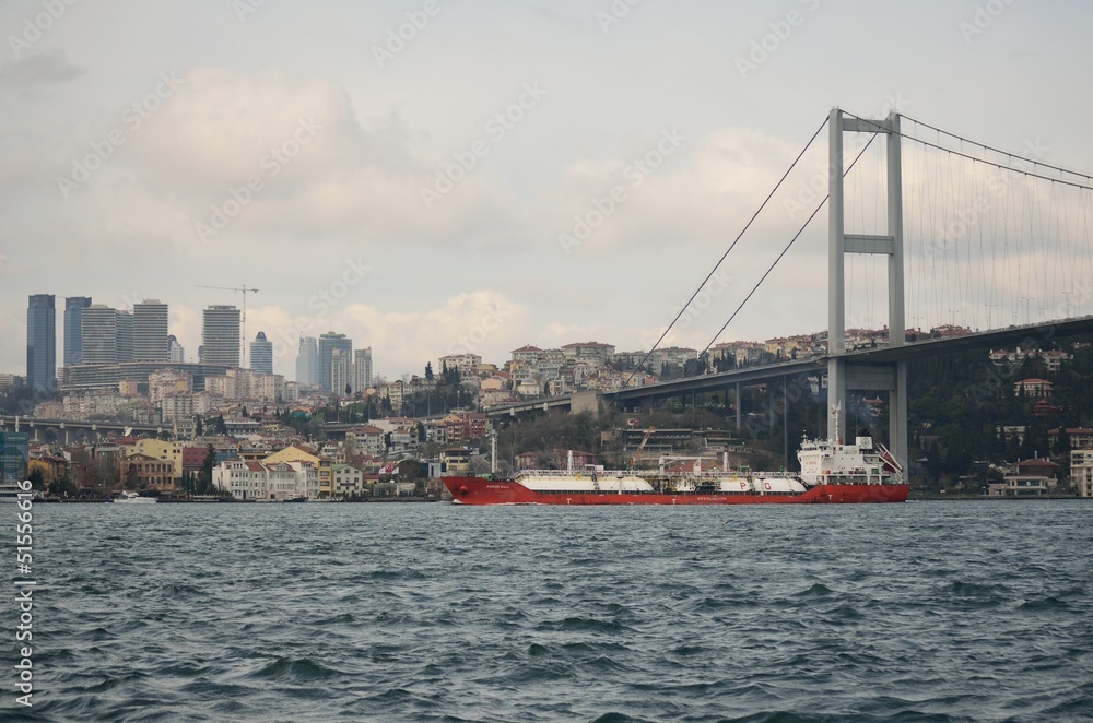 First Bosphorus bridge with ship in transit, Istanbul, Turkey