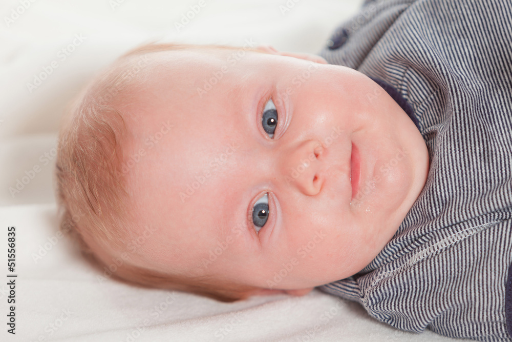 Cute baby with blonde hair and blue eyes. Studio shot. Cute baby with blonde hair and blue eyes. Studio shot.