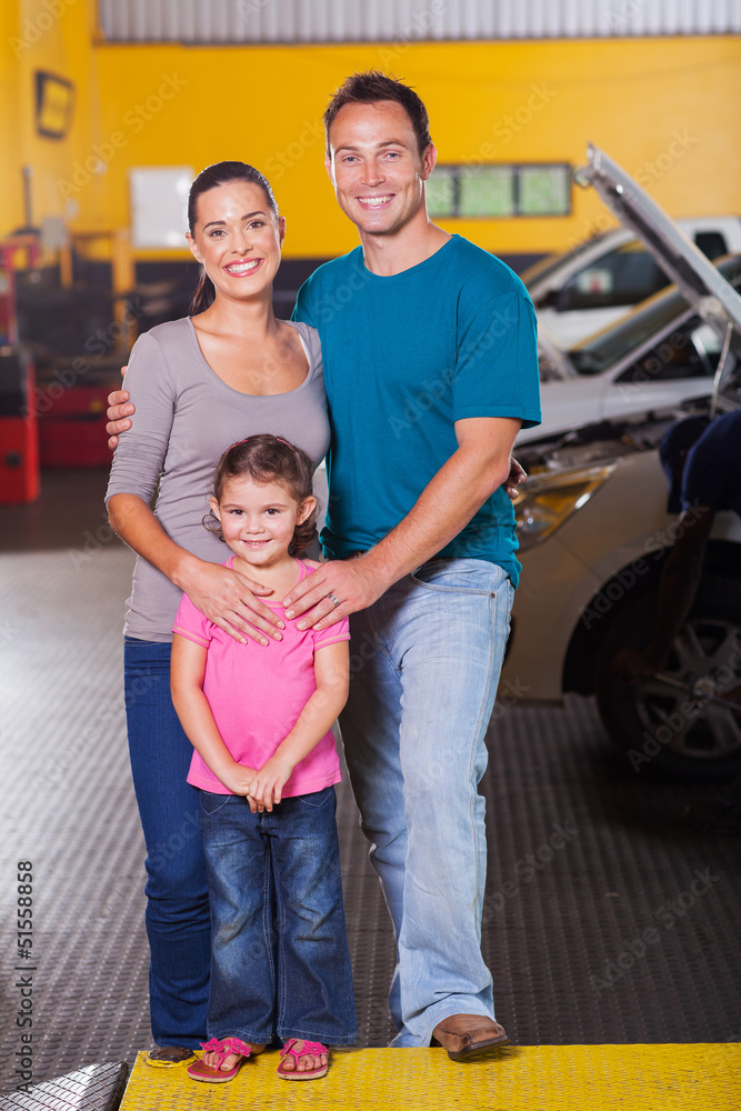 Obraz premium happy family in car service center