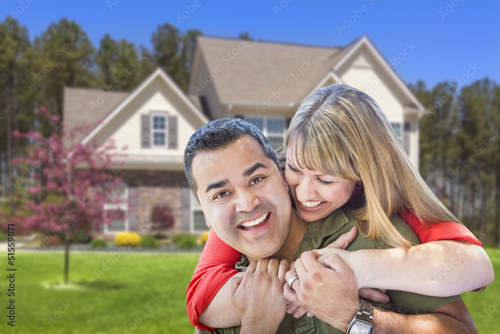 Mixed Race Couple Hugging in Front of House Mixed Race Couple Hugging in Front of House