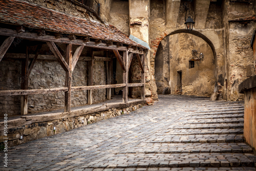 Medieval street view in Sighisoara, Transylvania, founded by sax