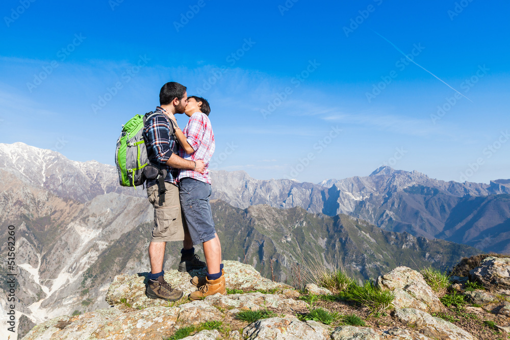 Couple Kissing at Top of Mountain