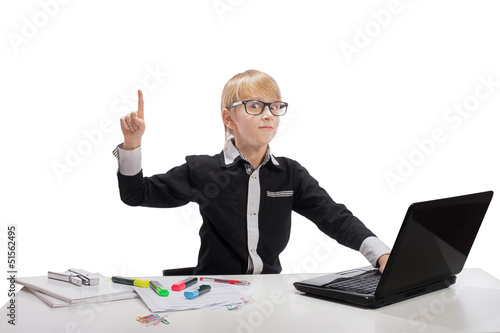 Funny boy with laptop raising index finger up looking at camera