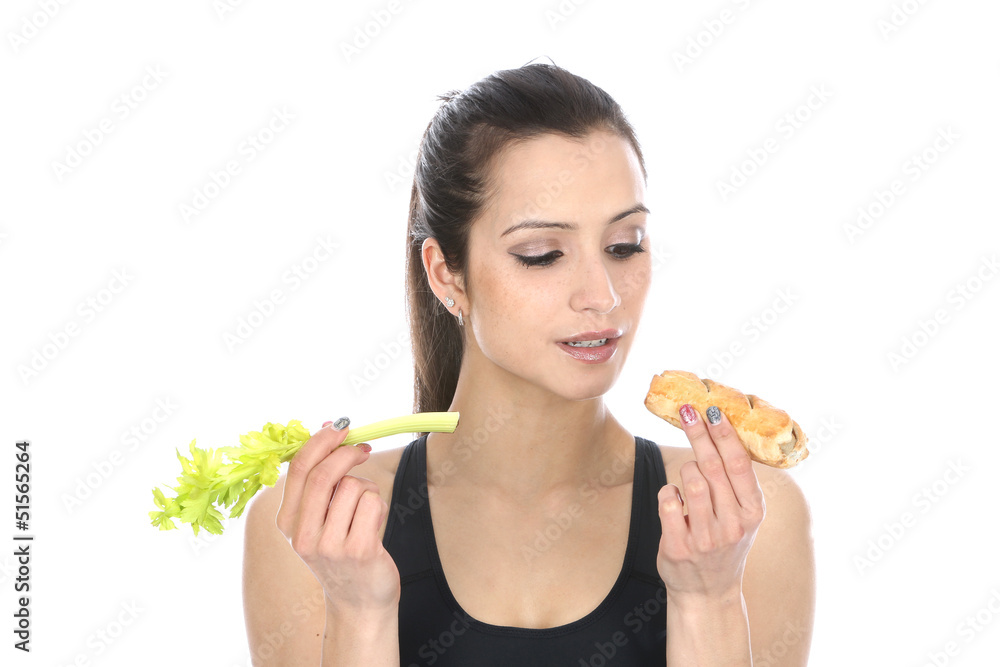 Model Released. Woman Holding Celery and a Sausage Roll Model Released. Woman Holding Celery and a Sausage Roll