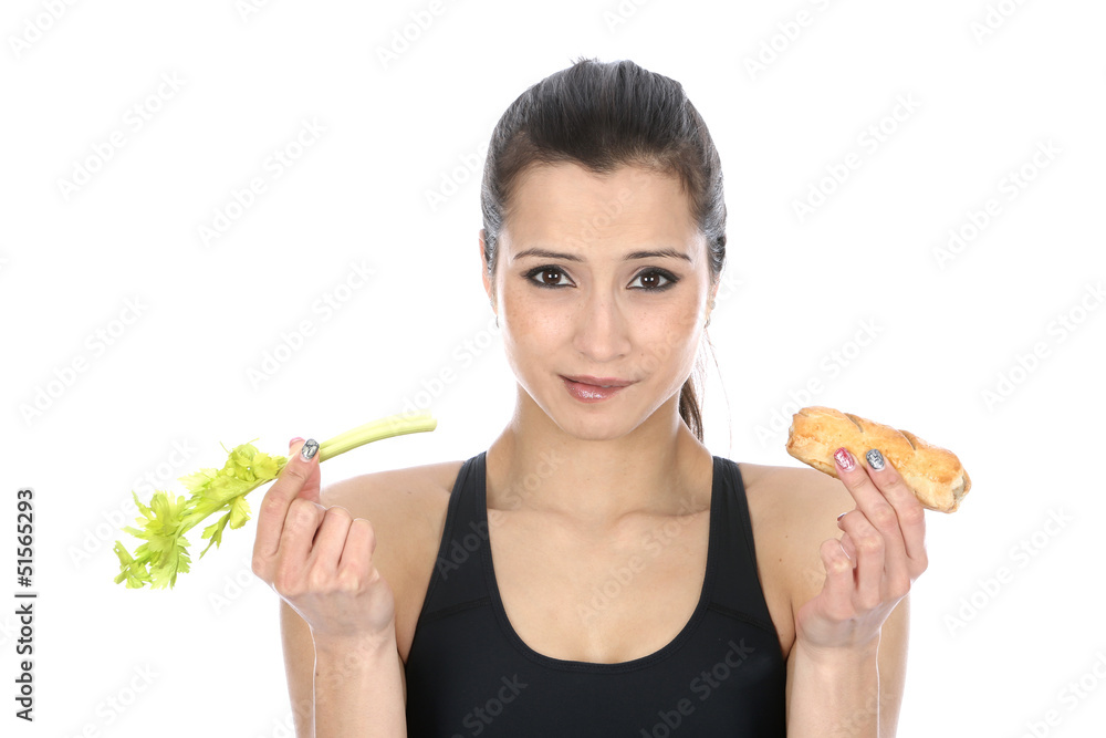 Model Released. Woman Holding Celery and a Sausage Roll Model Released. Woman Holding Celery and a Sausage Roll