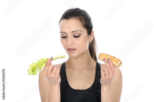 Model Released. Woman Holding Celery and a Sausage Roll