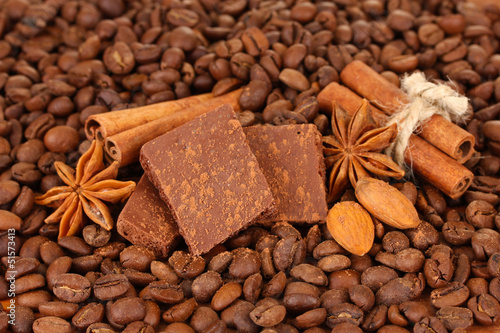 Chopped chocolate with cocoa, spices, on coffee beans