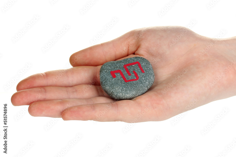 Fortune telling with symbols on stone in hand isolated on Fortune telling with symbols on stone in hand isolated on