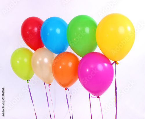 Many bright balloons isolated on white