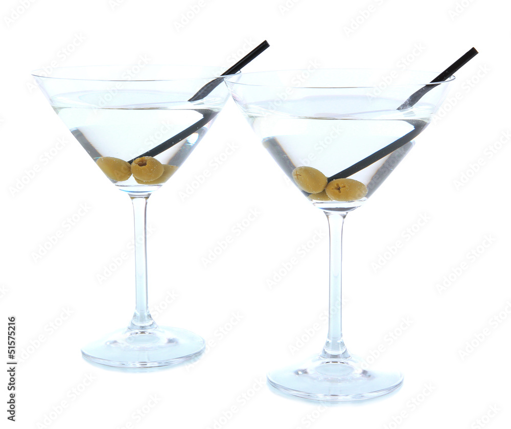 Martini glasses with olives isolated on white.