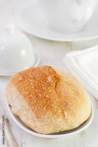 bread on white dish and white cup