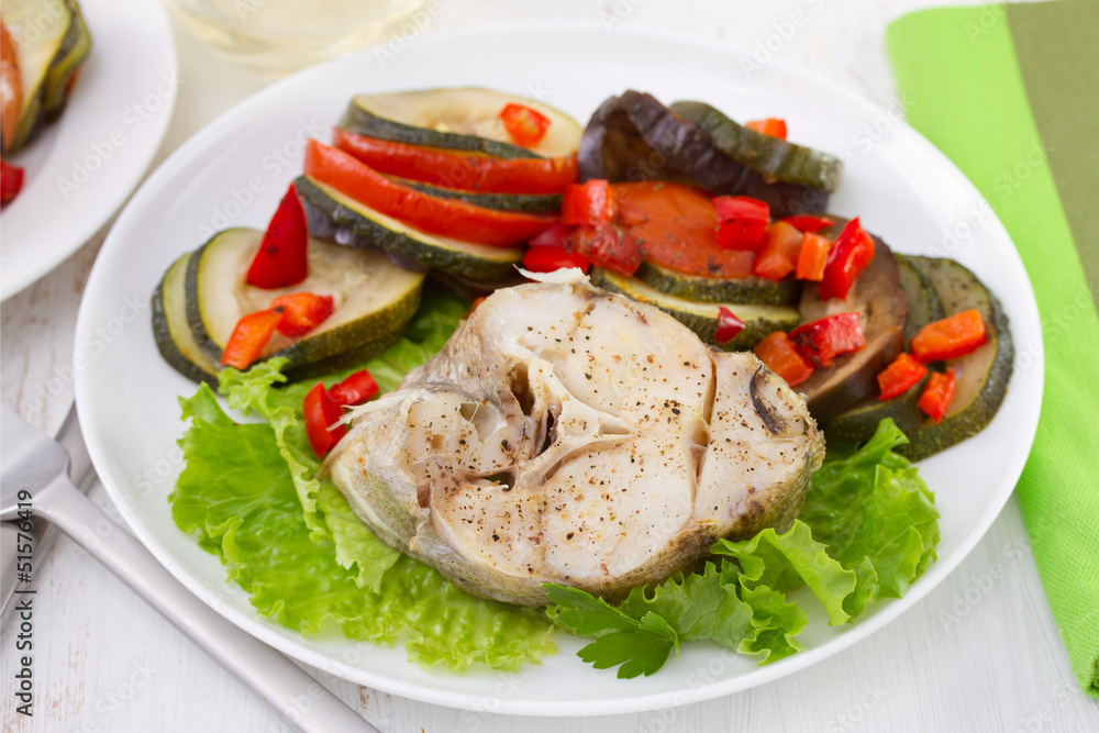 boiled fish with vegetables on the plate boiled fish with vegetables on the plate