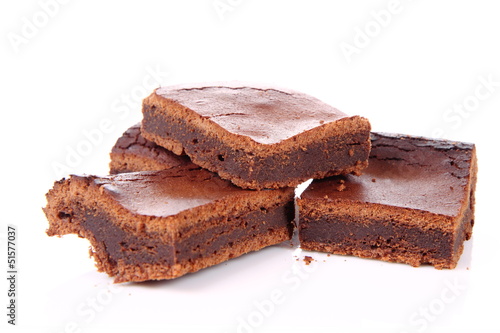 Slices of a brownie on white background