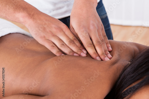 Woman Receiving Massage At Spa