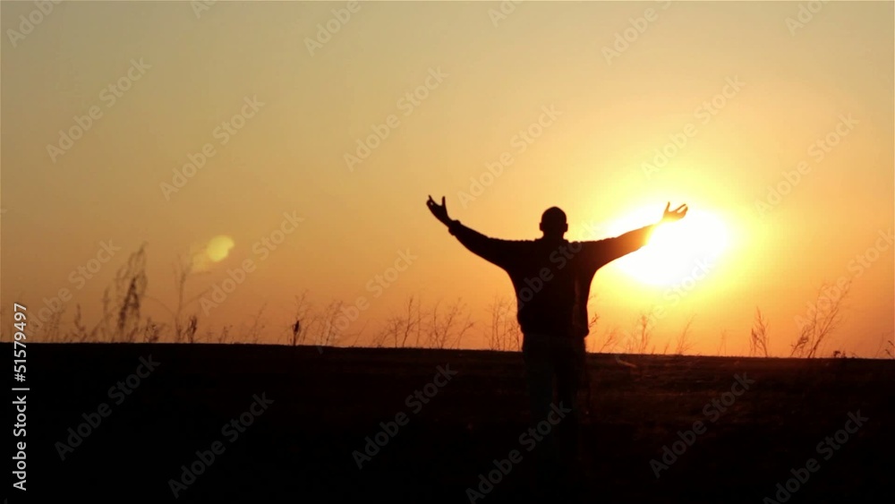 Silhouette of man on the sunrise. Freedom concept. Silhouette of man on the sunrise. Freedom concept.