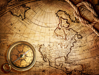 old compass and rope on vintage map 1746