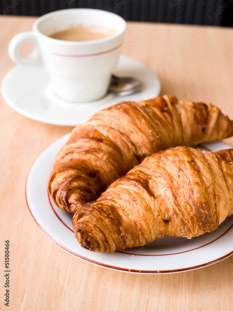 Breakfast with coffee and croissants