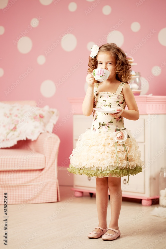 Little sweet girl with tea