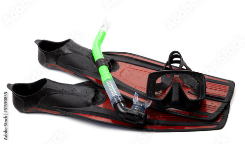 Mask, snorkel and flippers with water drops