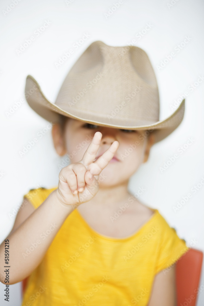 Portrait of an Asian girl in a cowboy hat Portrait of an Asian girl in a cowboy hat