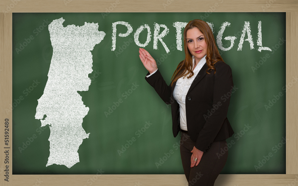 Teacher showing map of portugal on blackboard Teacher showing map of portugal on blackboard