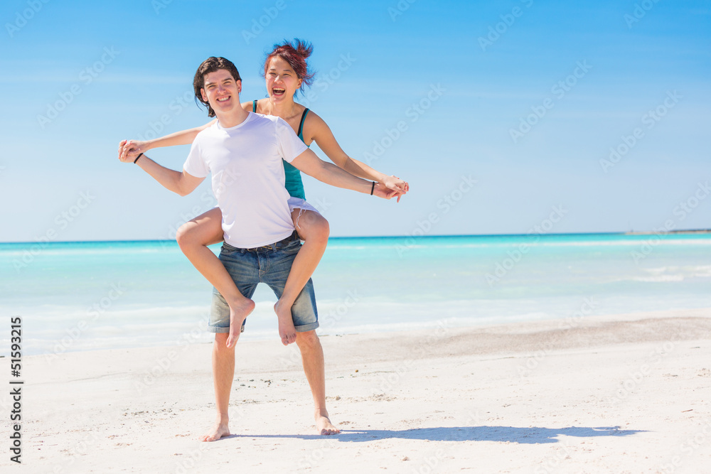 Man Giving a Piggyback Ride to His Girlfriend Man Giving a Piggyback Ride to His Girlfriend