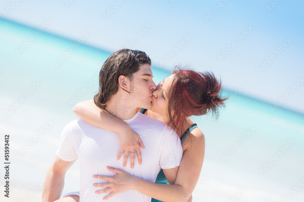 Man Giving a Piggyback Ride to His Girlfriend Man Giving a Piggyback Ride to His Girlfriend