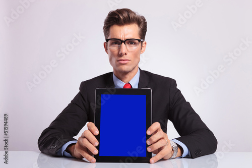 business man shows tablet