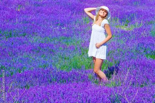 Fototapeta Naklejka Na Ścianę i Meble -  Pretty girl on lavender glade