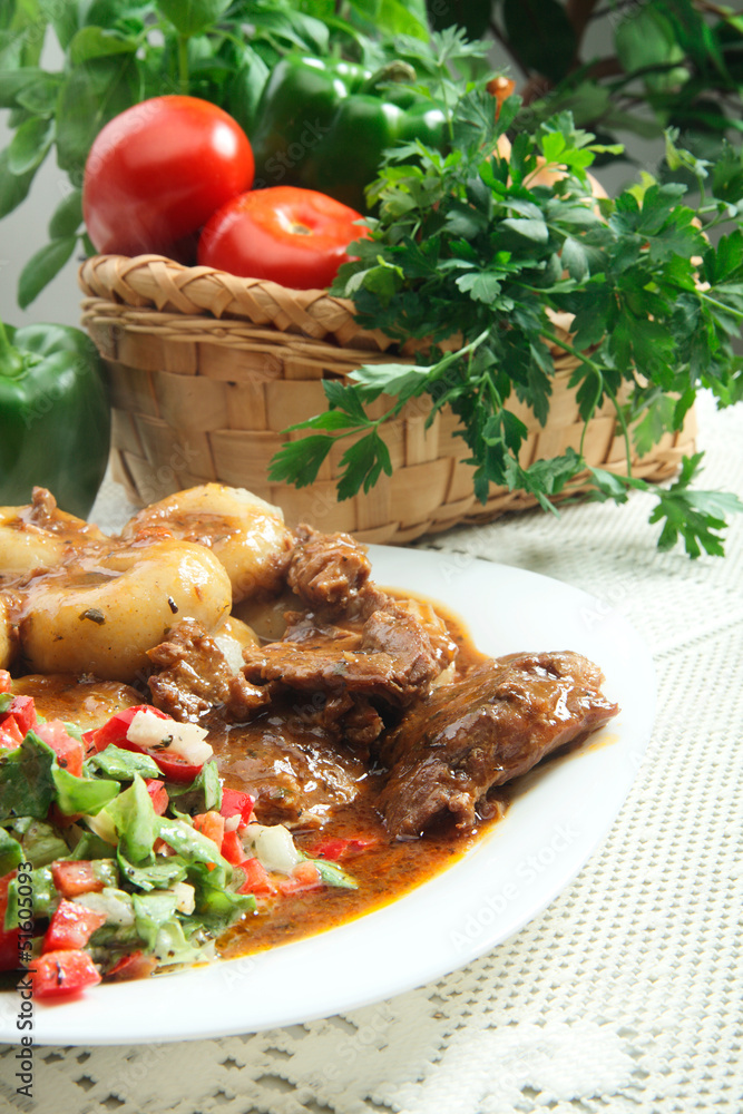 Roasted shoulder with sauce and dumplings