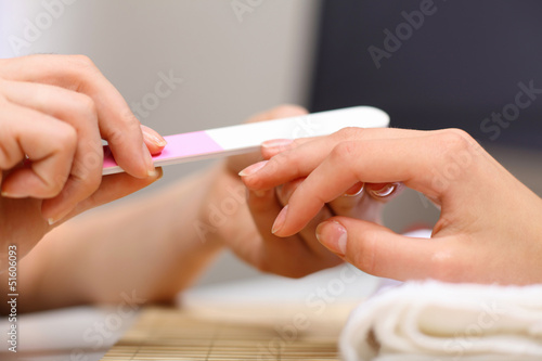 Woman is getting manicure