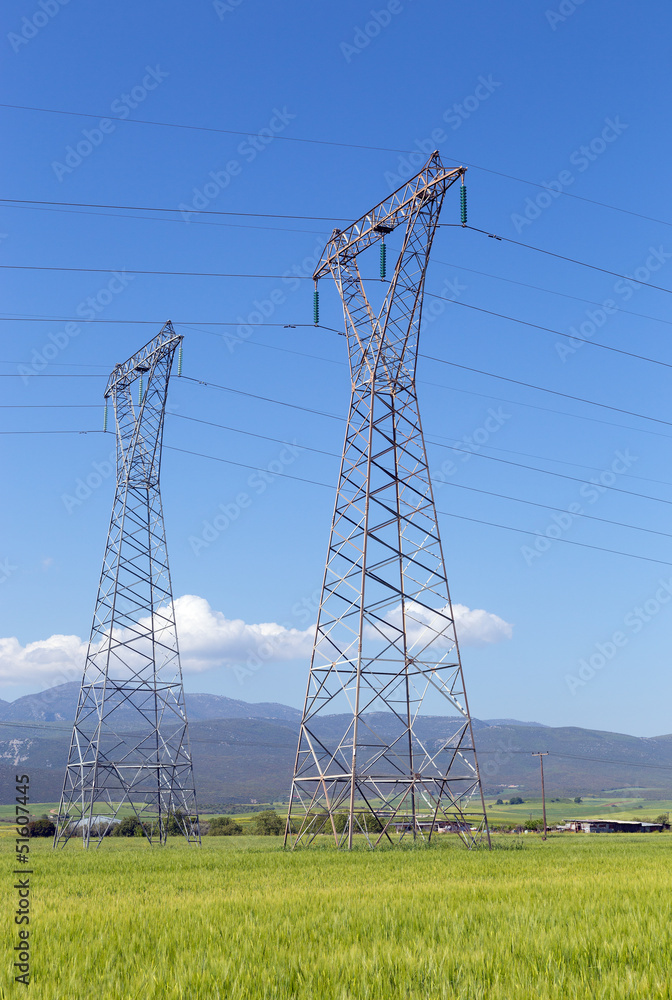 High voltage electricity pylons in rural landscape Stock Photo | Adobe ...