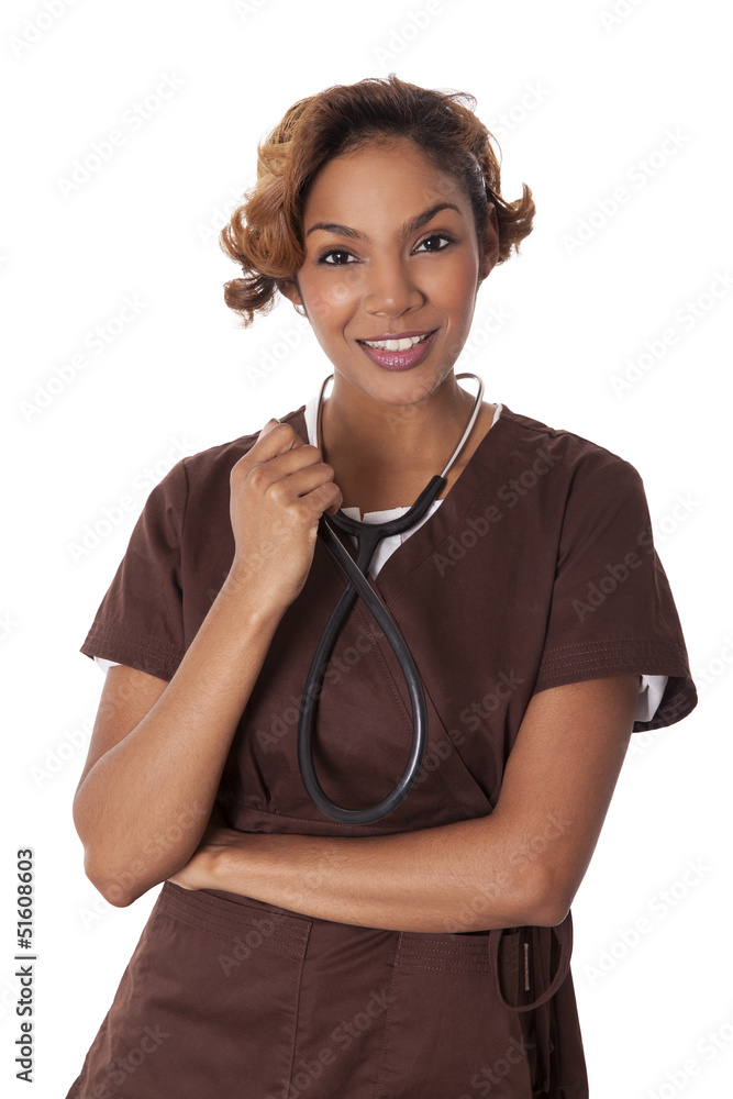 Female nurse in scrubs holds a stethoscope. Female nurse in scrubs holds a stethoscope.