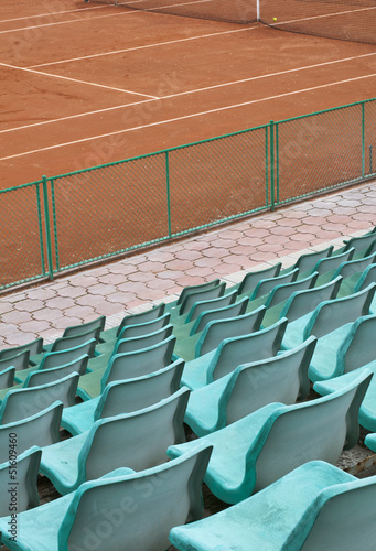 Grandstand seats and tennis court
