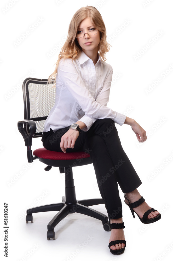 Businesswoman in an armchair isolated on white background Businesswoman in an armchair isolated on white background