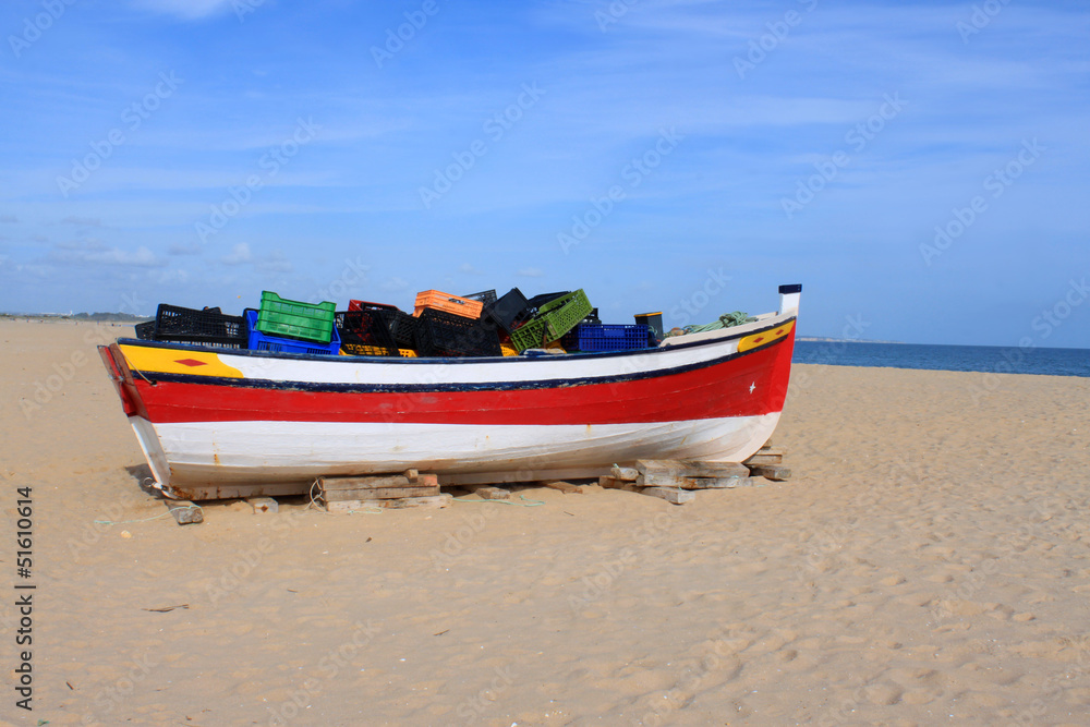Naklejka premium Fishing boat in Meia Praia, Lagos, Algarve, Portugal