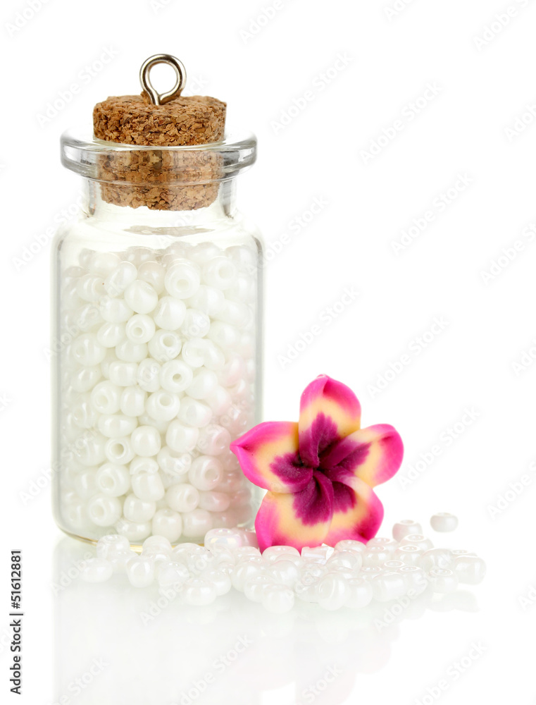Little bottle full with colorful beads isolated on white Little bottle full with colorful beads isolated on white