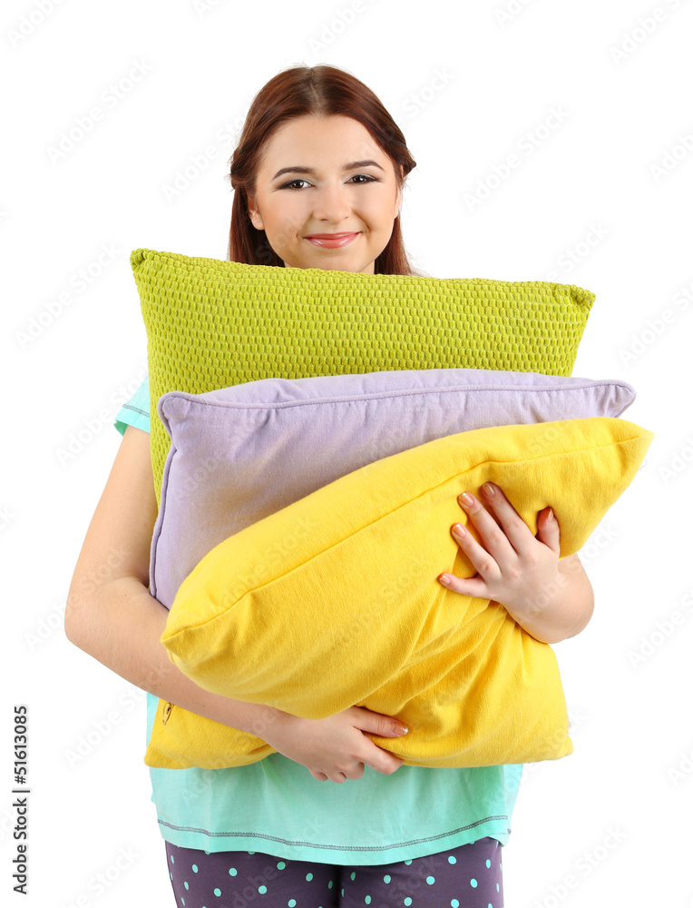 Beautiful young girl with pillows isolated on white. Beautiful young girl with pillows isolated on white.