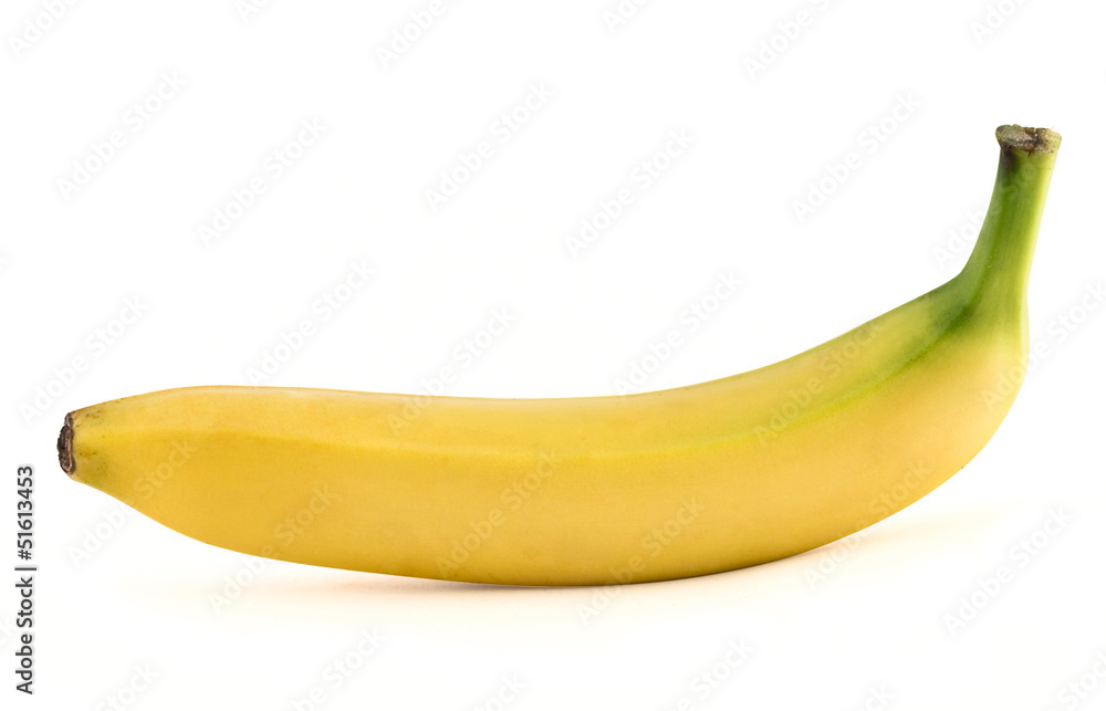 Single yellow spotless banana over white