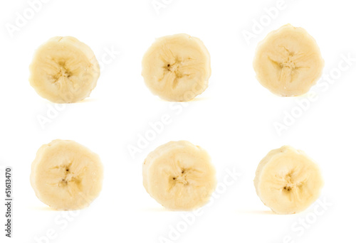 Six banana slices set over white background