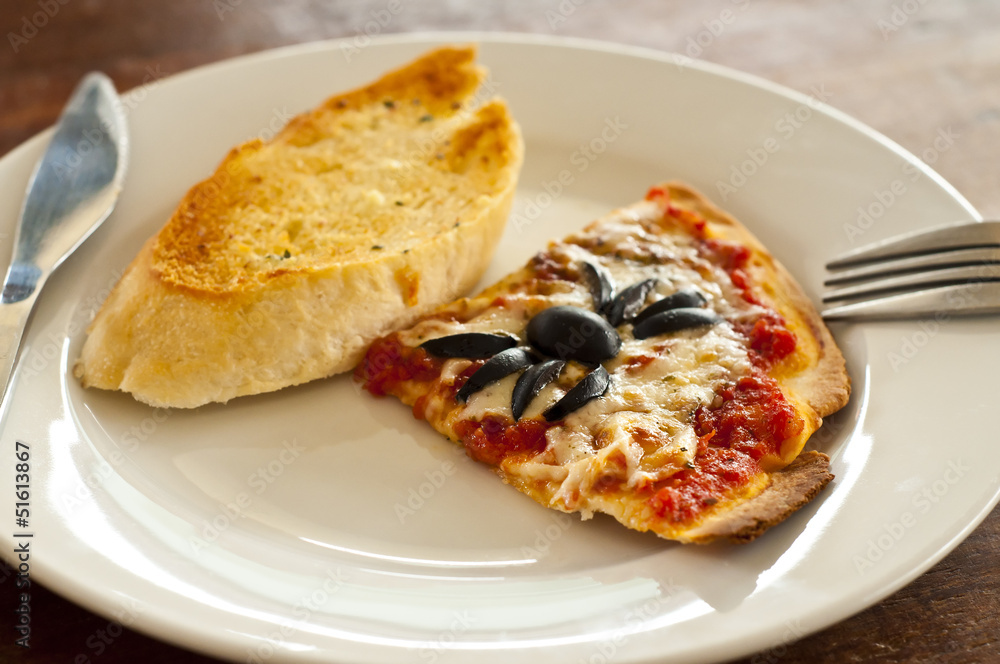 Pizza and garlic bread. Pizza and garlic bread.