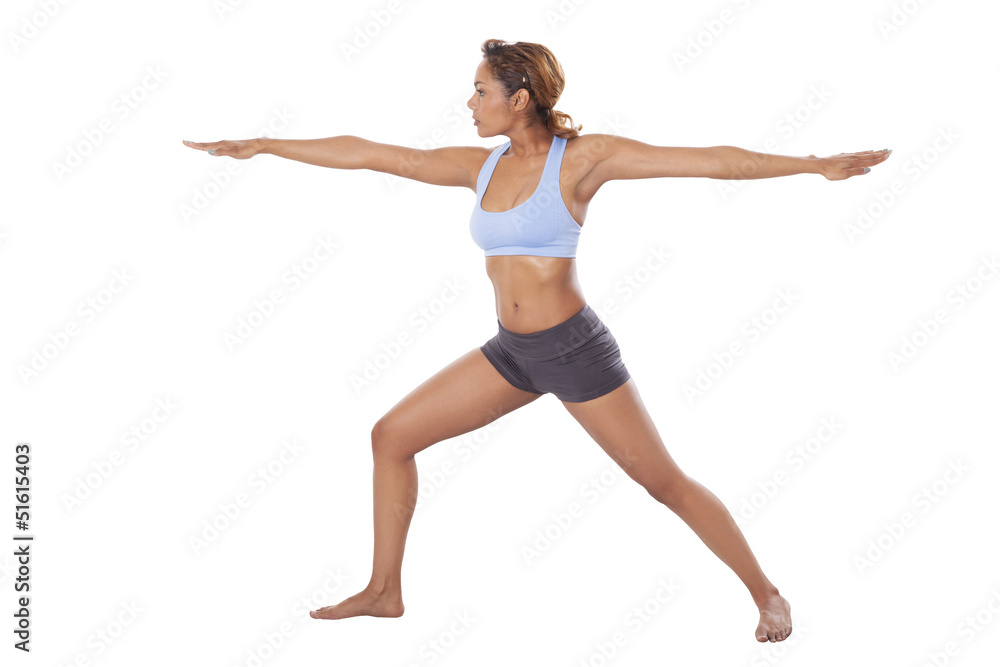 Latin woman performs Yoga moves.